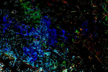 Space abstraction. Dark spheres are illuminated by blue rays of lights and are located against a black background. 3D 