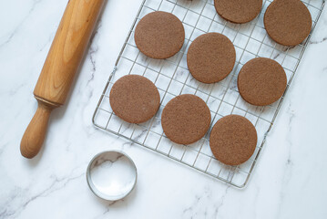 Overhead view of homemade chocolate cookies and a rolling pin