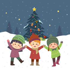 Obraz na płótnie Canvas Happy kids playing near the Christmas tree under the snow.