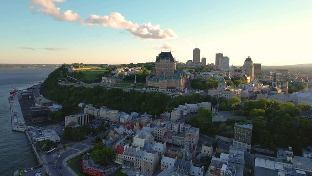 Sunset over a castle towering over an old city