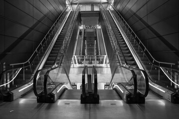 Beautiful shot of some escalators in a building in grayscale