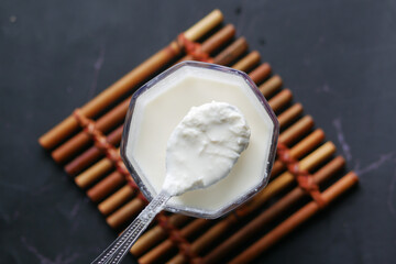 glass of whole cream milk on table , Cream of milk.