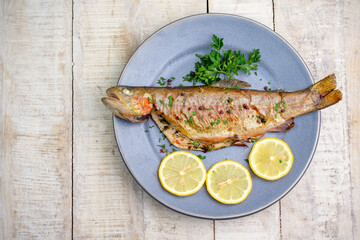 Grilled trout, top view, flat lay. Copy space for text or logo.