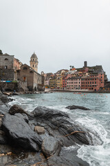 Beautiful vintage cozy town with old houses on a rock by the sea in Vernazza, Italy