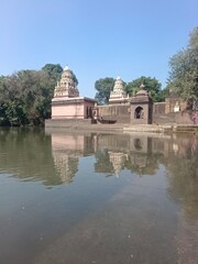 Fototapeta na wymiar Wai, Maharashtra, India, 30 October 2022, Temple on Krishna Ghat, Bank of Krishna river, Menavali Ghat, Wai, Maharashtra, India.