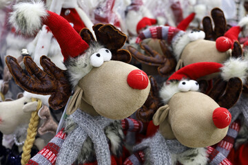 Christmas toys in a store. Stuffed deer figures, New Year gifts for winter holidays