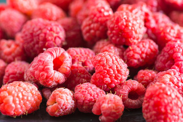 Close up for red raspberries on sunlight