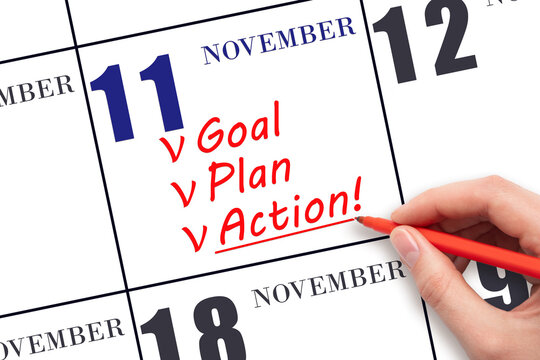 Hand writing text GOAL PLAN ACTION  on calendar date November 11. Motivation for a new day. Business concept.