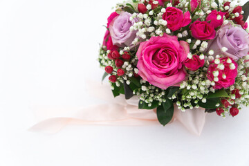 winter wedding bouquet with rose flowers lies on the snow