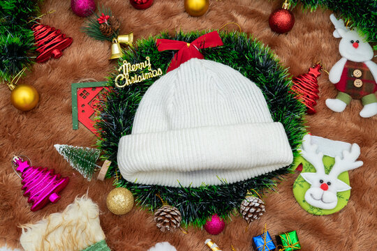 Blank white beanie hat mockup image with christmas decorations