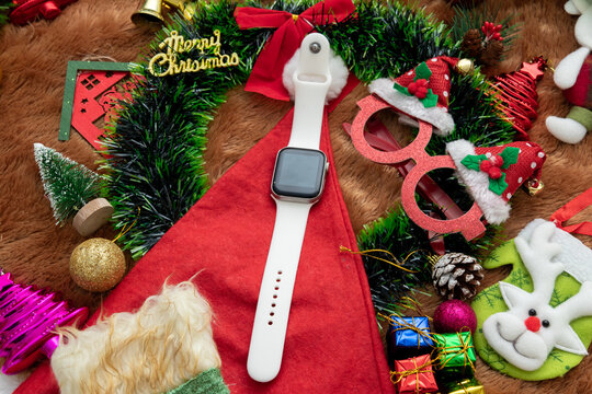 Blank Black Screen Smartwatch Mockup Image With Christmas Themed Decorations