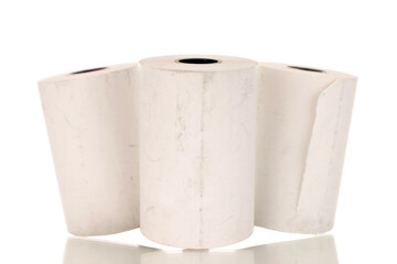 Three rolls of paper cash register tape, close-up isolated on white.