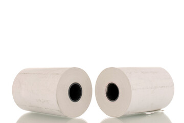 Two rolls of paper cash register tape, close-up isolated on white.