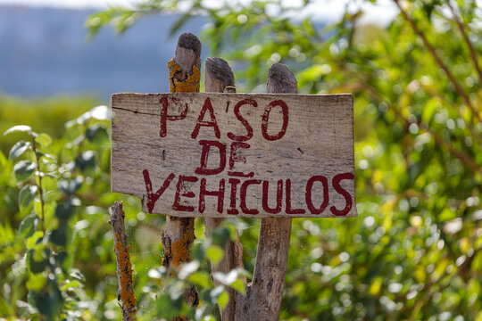 Wooden Sign Saying 'Paso De Vehiculos' in Spain