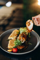 Chicken baked in a sauce with cheese strips fried in a deep fryer.