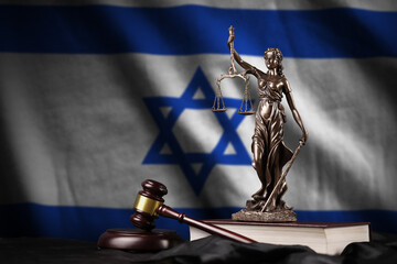 Israel flag with statue of lady justice, constitution and judge hammer on black drapery. Concept of...