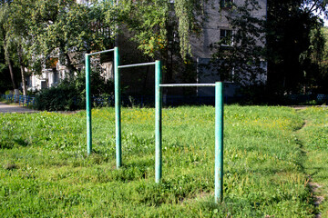 Fototapeta na wymiar iron horizontal bars for sports in the yard.