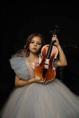 young girl violinist with dress with violin
