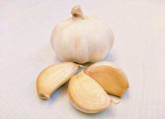 Fresh raw whole garlic bulb and garlic-cloves organic lehsun ajo alho closeup view image photo