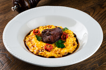 Italian Milanese risotto with beef close up
