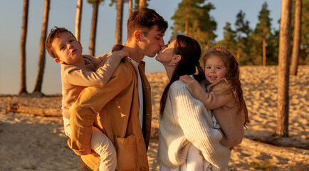 Family on the beach in autumn