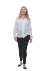 happy mature woman in a new blouse striding forward.