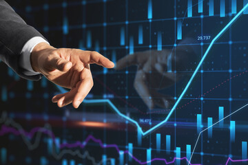 businessman hand pointing at creative candlestick forex chart index hologram on blurry blue background with reflection. Trade, business market and finance analysis concept. Double exposure.