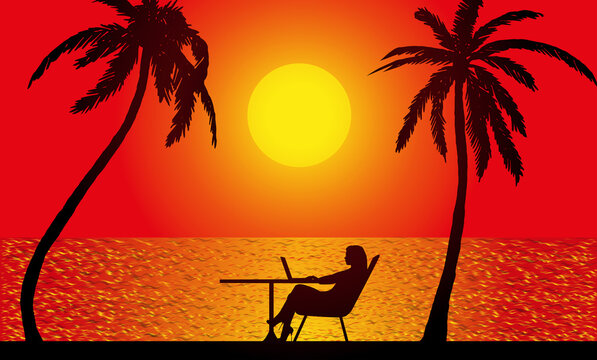 silhouette of a woman sitting with a laptop at a table and palm trees against the backdrop of the setting sun over the sea