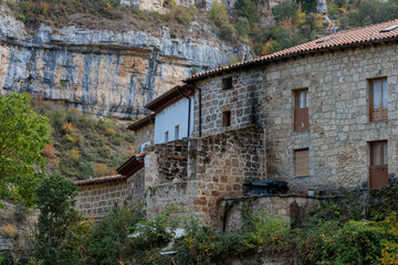 Traditional Stone Houses beneath Cliffs in Orbaneja del Castillo, Spain