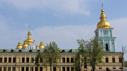 Golden domes on the blue temple on the background of the sky. St. Michael's Cathedral in Kyiv.