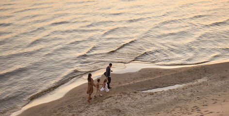 Family on the beach in autumn