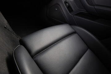 Close-up view of modern car leather seat at the luxury interior