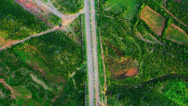 Aerial footage of an empty road in Margalla hills in Islamabad, Pakistan, in daylight