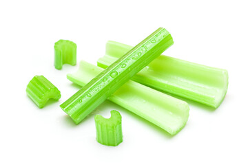 Fresh Chopped Celery Sticks and Slices with Water Drops Isolated on White Background. Vegan and Vegetarian Culture. Raw Food. Healthy Diet with Negative Calorie Content