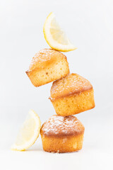 On a light background, muffins and lemon slices.