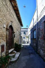 Fototapeta na wymiar A small street between ancient buildings in Boville Ernica, a historic town in the province of Frosinone, Italy.