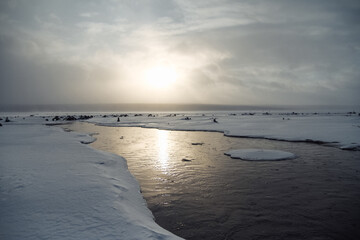 seashore in winter with ice