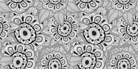 Black and white floral scribble illustration. Abstract hand drawn flower seamless background.