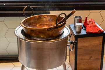 Pan to prepare caramel apples in dessert shop 