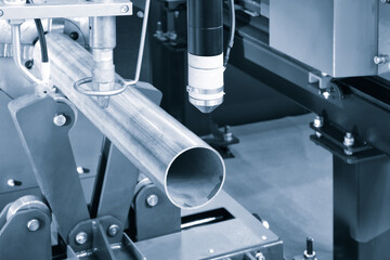 Cutting of metal with sparks fly from laser, modern industrial technology concept