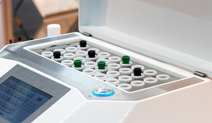 A large number of test tubes in the laboratory storage apparatus. Blood collection concept in case...