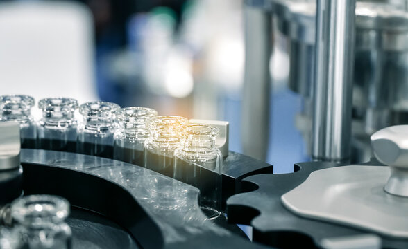 Pharmacological Production. Aseptic Vaccine Vials In The Production Line. Sterile Capsules For Injection Bottles On The Bottling Line Of The Pharmaceutical Plant.	