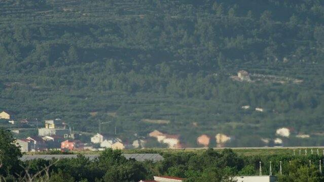 A passenger plane takes off at an airport in the mountains. The plane with tourists takes off from the ground. High quality 4k footage