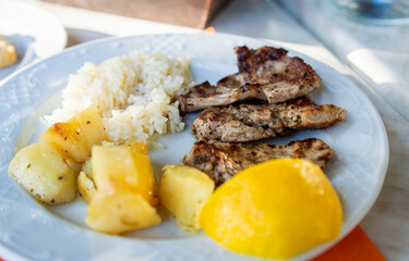 Greek grilled pork with rice and potatos from a Greece local resturant