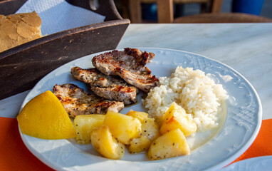 Greek grilled pork with rice and potatos from a Greece local resturant