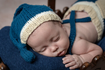 Cute newborn baby in a wooden basket