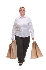 Full length portrait of a woman walking with shopping bags