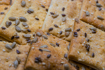 Puff pastry with sunflower seeds close-up.