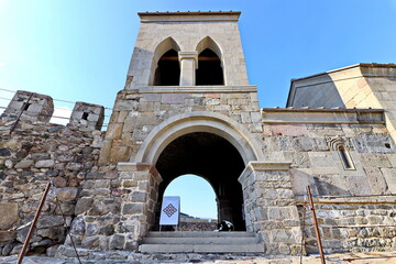 Various views of an ancient fortress, walls, buildings and structures on background of the blue sky. Khertvisi Fortress, Georgia. 