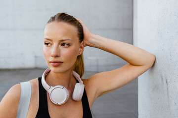 Young beautiful serious sporty woman propping her head looking aside © Drobot Dean